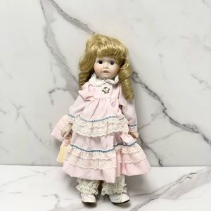 Brinns musical collectibles - porcelain dolls